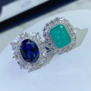 Halo-Set Oval Blue and Emerald-Cut Green Gemstone Rings