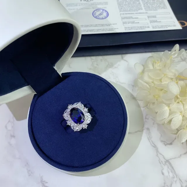 Halo-Set Oval Blue and Emerald-Cut Green Gemstone Rings 4