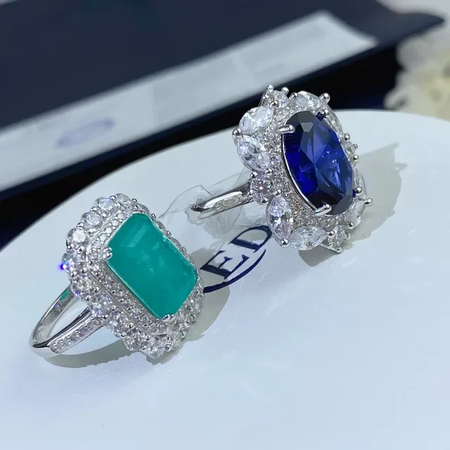 Halo-Set Oval Blue and Emerald-Cut Green Gemstone Rings 6
