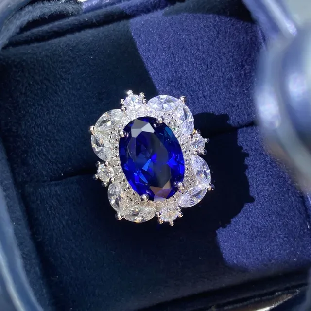 Halo-Set Oval Blue and Emerald-Cut Green Gemstone Rings 9