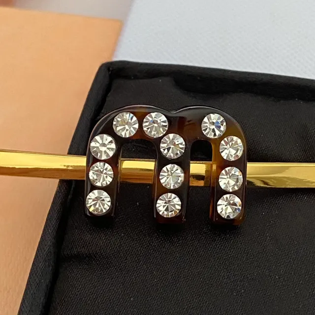 Broche de caparazão de tartaruga e cristal dourado motivo H 4