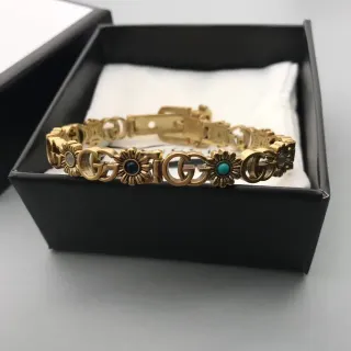 Gucci Gold Blue Metal Interlocking G Logo Bracelet