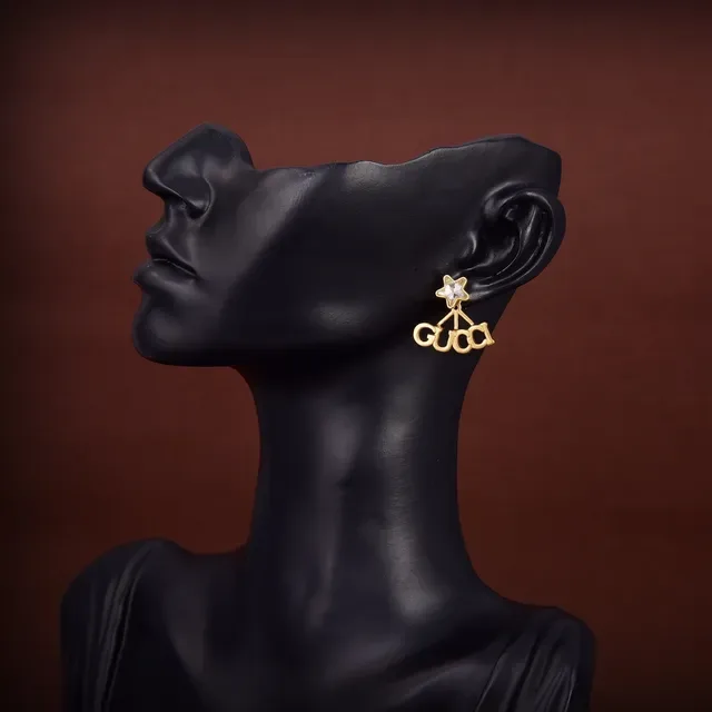Gucci Logo Star Boucles d'oreilles dorées transparentes 2