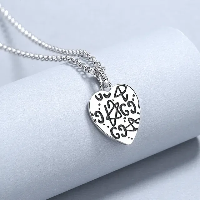 Gucci Silver Heart-Shaped Pendant Engraved Skull Motif Necklace 3