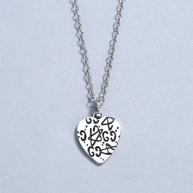 Gucci Silver Heart-Shaped Pendant Engraved Skull Motif Necklace 4