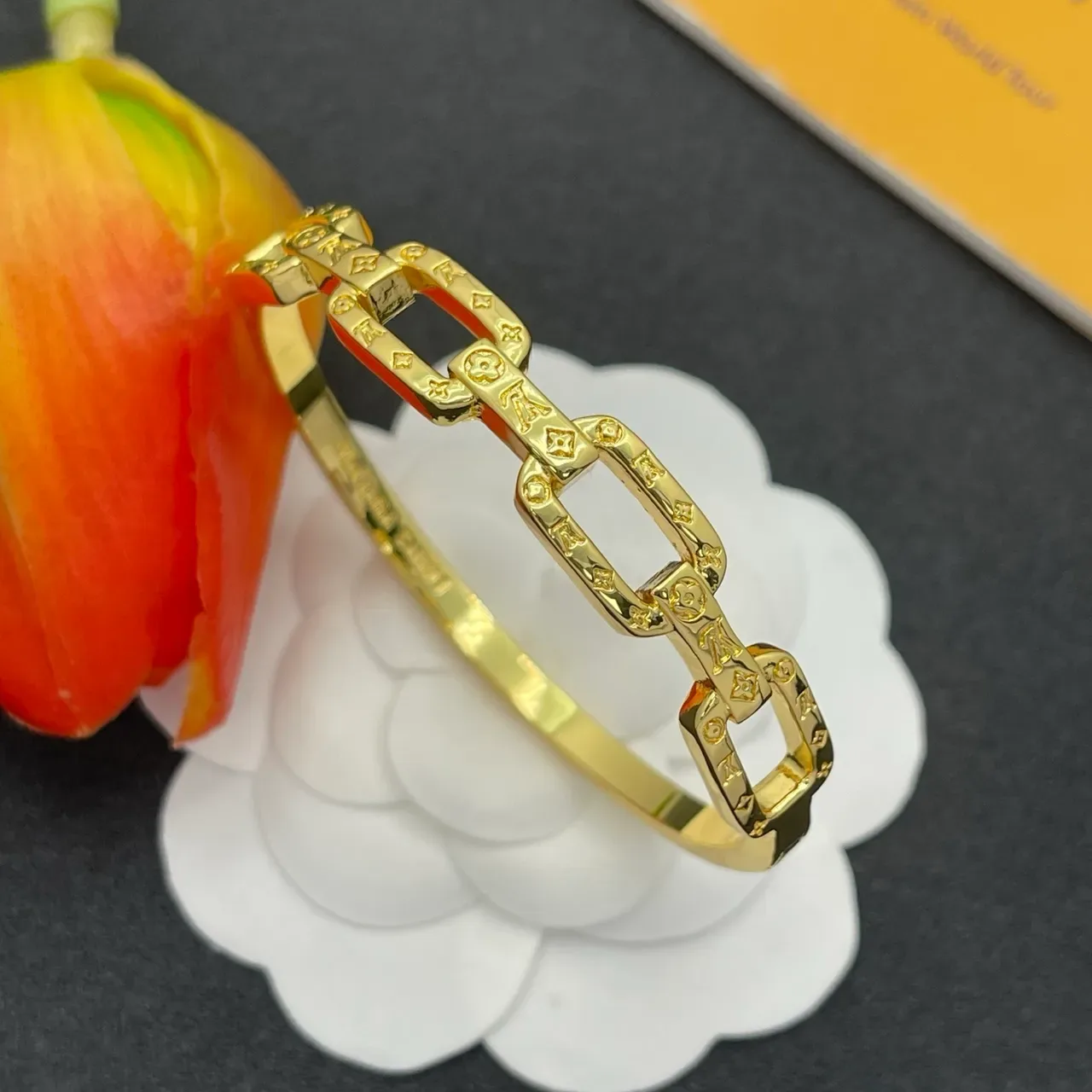Louis Vuitton Chain Reaction Embossed Monogram Gold-Tone Link Bracelet 6