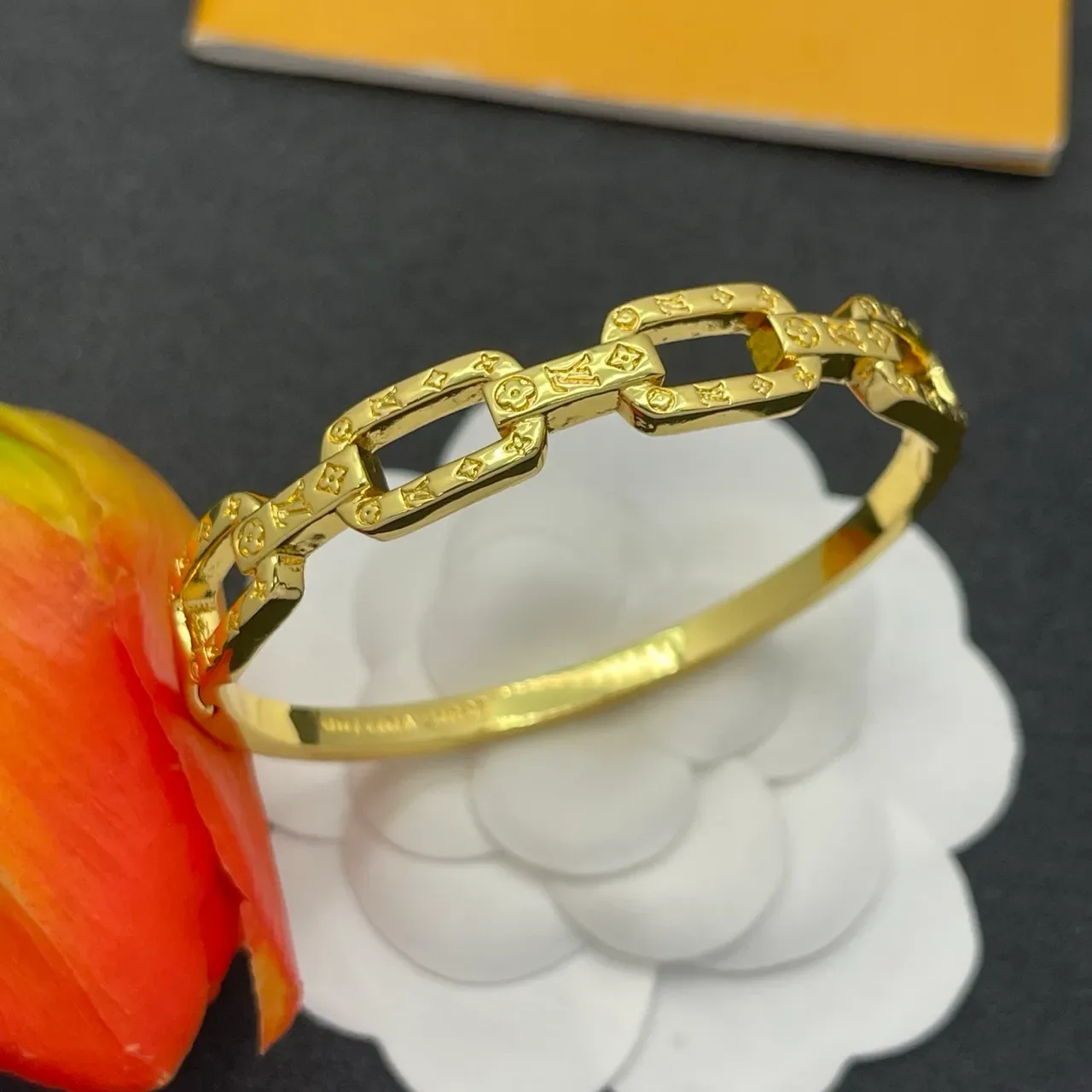 Louis Vuitton Chain Reaction Embossed Monogram Gold-Tone Link Bracelet 7