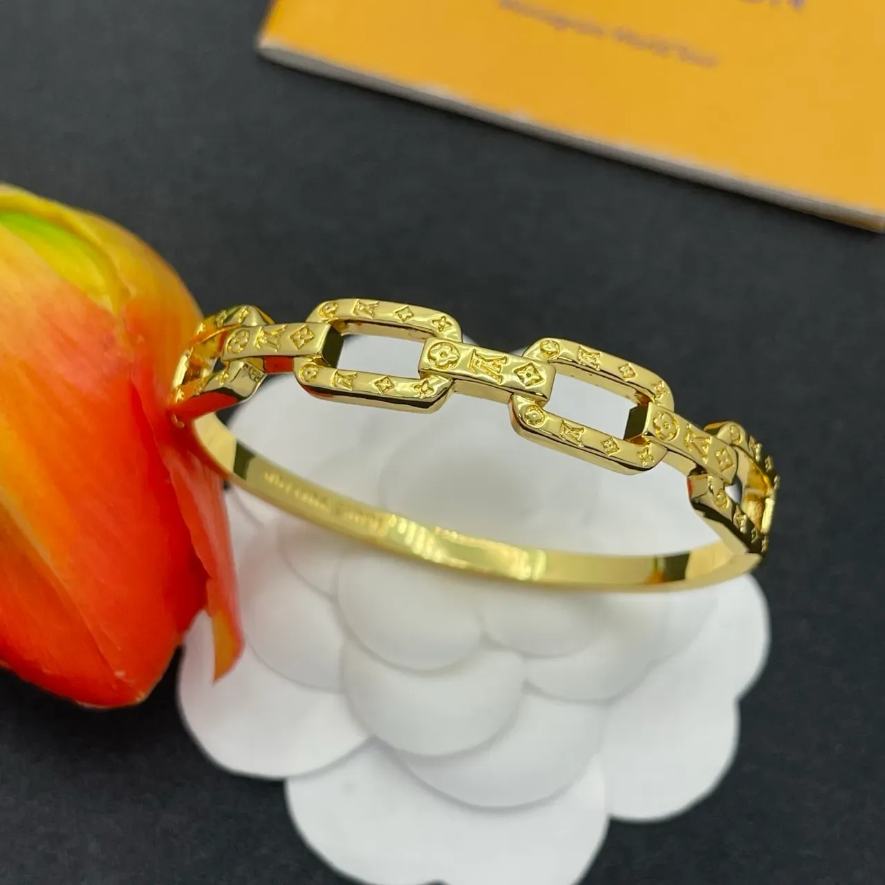 Louis Vuitton Chain Reaction Embossed Monogram Gold-Tone Link Bracelet 8