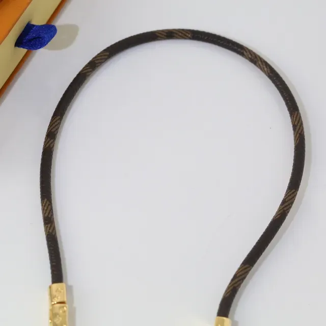 Louis Vuitton Double-Wrap Monogram Leather and Gold-Tone Bracelet 5