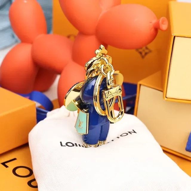 Louis Vuitton Broche com Encanto Floral Chaveiro em Ouro e Cristal Azul 4