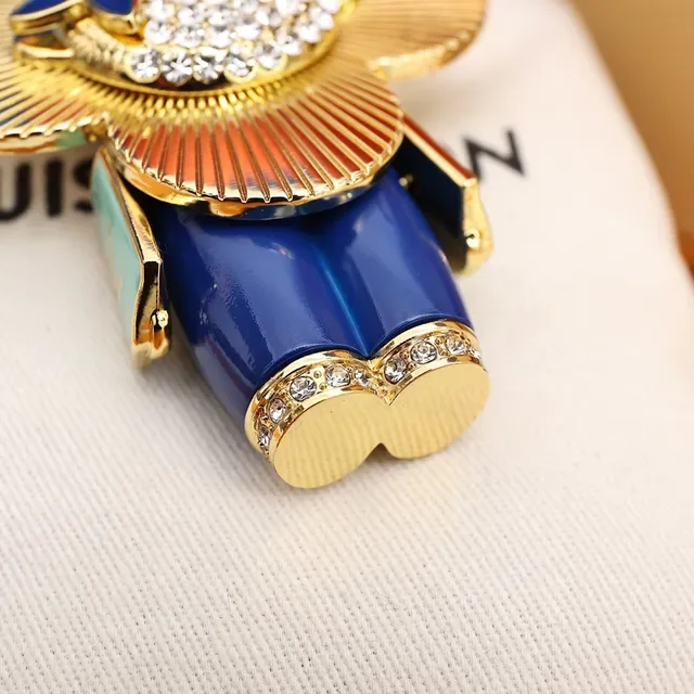 Louis Vuitton Broche com Encanto Floral Chaveiro em Ouro e Cristal Azul 6