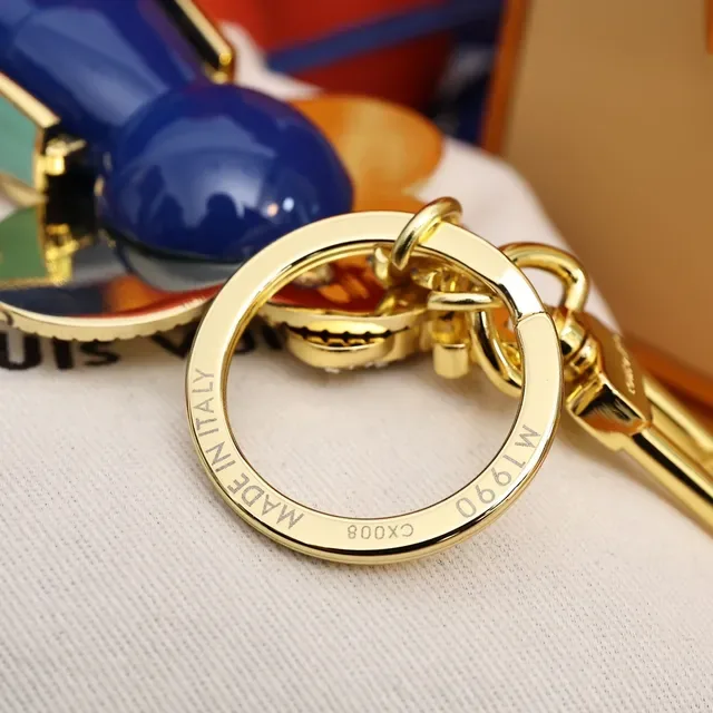 Louis Vuitton Broche com Encanto Floral Chaveiro em Ouro e Cristal Azul 7
