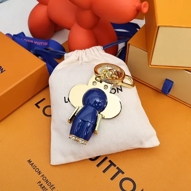 Louis Vuitton Broche com Encanto Floral Chaveiro em Ouro e Cristal Azul 8