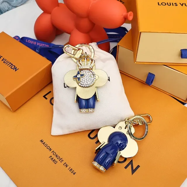 Louis Vuitton Broche com Encanto Floral Chaveiro em Ouro e Cristal Azul 9