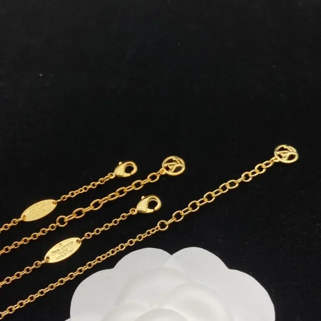 Louis Vuitton Gold Transparent Charm-Dangling Earrings 4