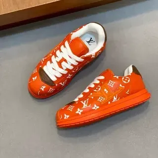 Louis Vuitton zapatillas lifestyle de bajo con impresión monogram en naranja y blanco