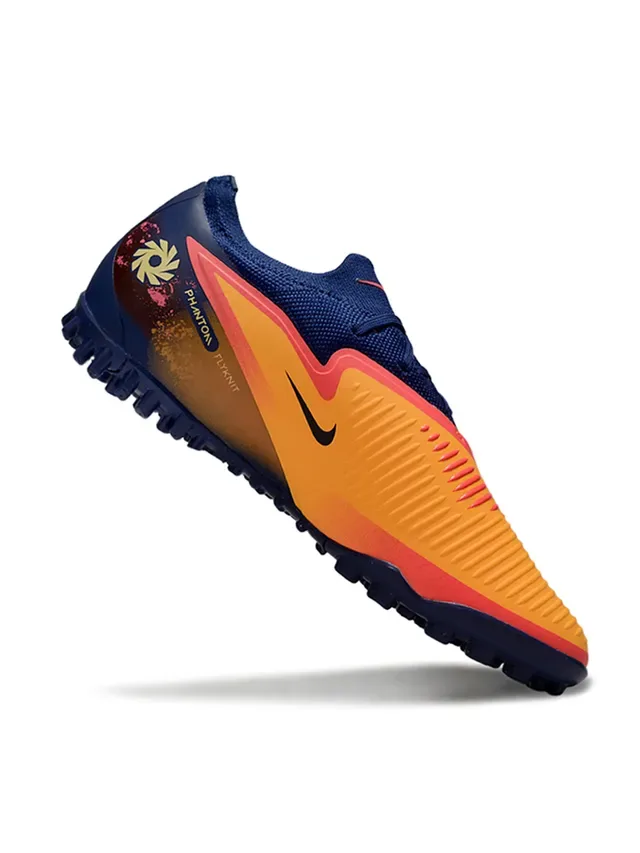 Nike Chaussures de football low-cut avec upper en knit synthétique color bleu marine orange semelle Reactx cushioned pour gazon artificiel 2