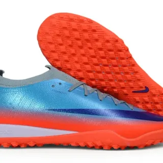 Nike Chuteiras de grama com upper em malha, colorway degradê laranja e azul