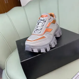 Prada Cloudbust رمادي وبرتقالي حذاء رياضي سميك