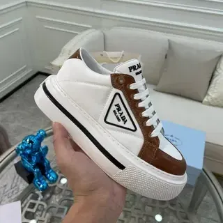Prada Cloudbust حذاء رياضي أبيض وبني من الجلد منصة نمط حياة